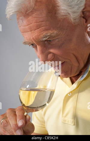 Close-up of Man Smelling Wine from Glass Stock Photo
