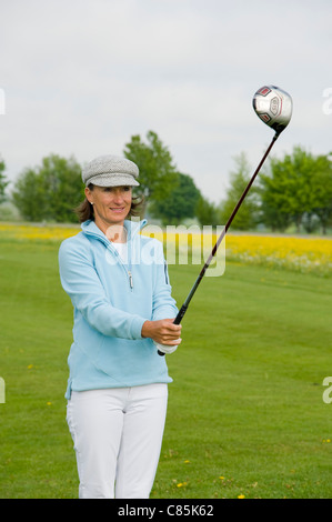 Woman Golfing, Berchtesgaden, Berchtesgadener Land, Oberbayern, Bavaria, Germany Stock Photo