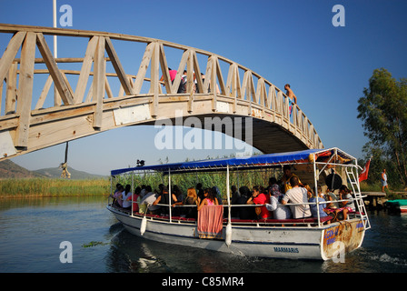 AKYAKA, TURKEY. A pleasure boat taking holidaymakers along the Azmak river in the Gokova conservation area. 2011. Stock Photo