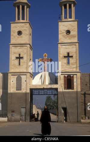 A Coptic Christian monk in front of Deir al Muharraq, the Burnt Monastery, in Egypt Stock Photo