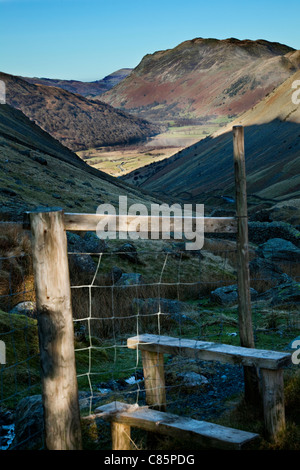 Countryside view towards Glenridding over fence style in Ullswater, Lake District, Cumbria, England, UK Stock Photo