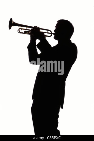 Silhouette of musician playing the trumpet Stock Photo