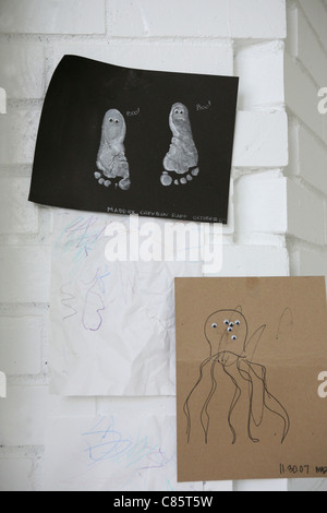 Kids art projects hanging on the wall Stock Photo