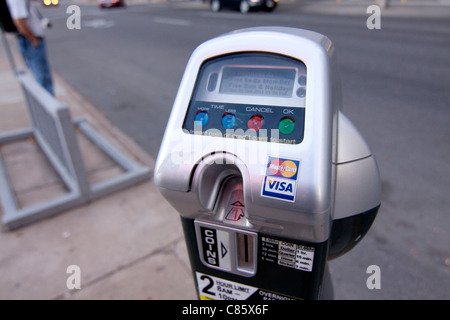 A parking meter in Denver Colorado that accepts credit cards in addition to coins. Stock Photo