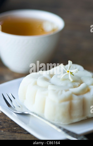 Close up of jasmine tea and rice cake Stock Photo