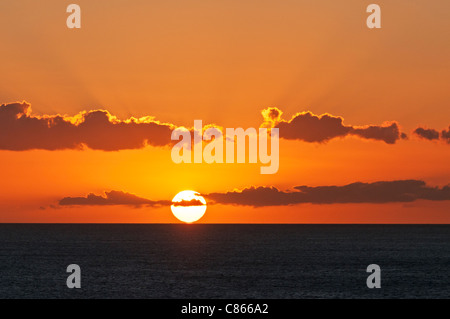 Hawaii travel: a colorful sunset off of Waikiki Beach, Honolulu, Hawaii. Stock Photo