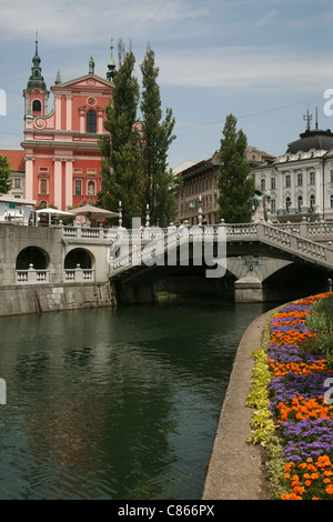 Tromostovje or the Triple Bridge over Ljubljanica River by architect Joze Plecnik (1929-1932) in Ljubljana, Slovenia. Stock Photo