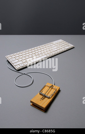 Keyboard connected with mousetrap Stock Photo