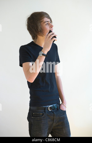 Young man talking on cell phone Stock Photo