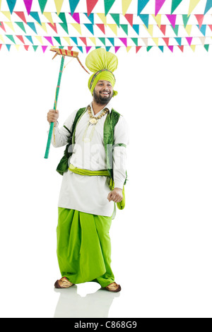 Sikh man holding a Katow Stock Photo