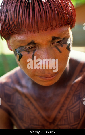 Posto Leonardo, Xingu, Brazil. Man with hair dyed with red Urucum paste and black genipapo body paint. Stock Photo