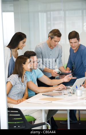 Business associates collaborating in office Stock Photo
