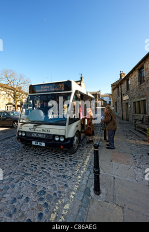 Boarding the Pride of the Dales bus in the Yorkshire Dales village of Grassington Stock Photo