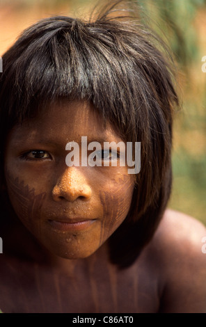 A-Ukre Village, Brazil. Pidjore, a Kayapo boy with intricate black genipapo face and body painting. Xingu Indian Reserve. Stock Photo