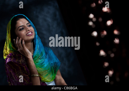 Muslim woman talking on the phone Stock Photo