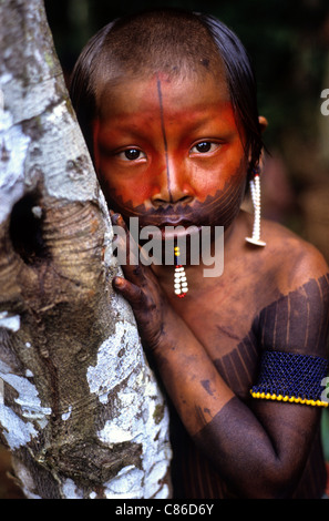 A-Ukre Village, Brazil. Young Kayapo boy with red urucum and black genipapo face paint and bead lip decoration. Para State. Stock Photo