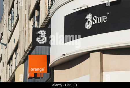 Orange and 3 mobile phone shops next door to each other Brighton UK Stock Photo