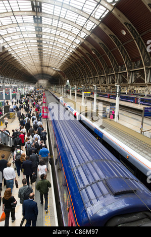 Rush hour commuters on platform at Paddington Station, London, England, UK Stock Photo