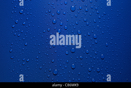 studio photography of roll-off water drops in blue back Stock Photo