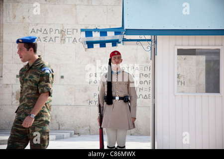 Evzones light infantry guard after being checked by an officer at the Presidential Mansion and Tomb of the Unknown Soldier. Stock Photo