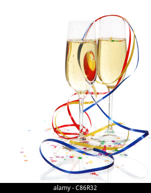 Champagne in two glasses with streamers over white background Stock Photo
