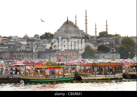 Waterfront at Eminonu with the Rustem Pasha Mosque on the skyline, Istanbul, Turkey Stock Photo