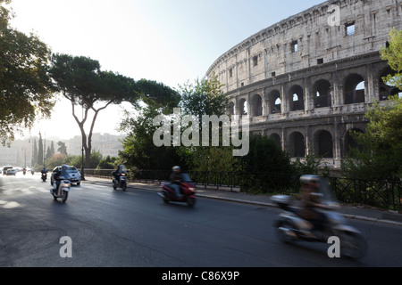 Traffic passing Colosseum in Rome Stock Photo