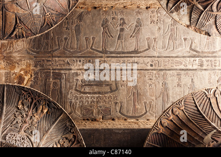 Column capital and astrologicalceiling within the Hypostyle Hall at the Ptolemaic Roman Temple Of Khnum at Esna, Egypt Stock Photo