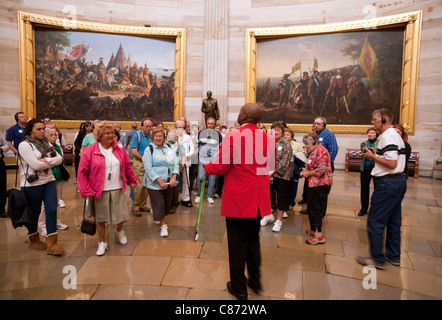Visitors on a guided tour of the rotunda, Capitol building, Washington DC, USA Stock Photo