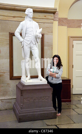 A female tourist posing in the National Statuary Hall, Capitol building, Washington DC USA Stock Photo