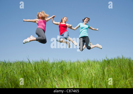Young Women Jumping Stock Photo