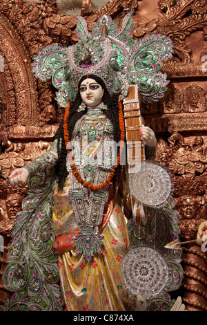 Depiction of Goddess of knowledge 'Saraswati' at 'Kobiraj Bagan Durga Puja pandal' in 'Ultadanga', Kolkata, West Bengal, India. Stock Photo