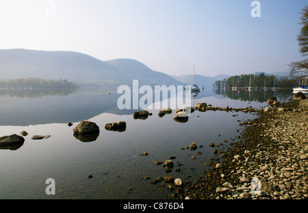 Ullswater lake at dawn with yachts and reflections Stock Photo