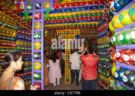 Devotees at 'Karbagan Durga Puja pandal' made of coloured plastic balls in 'Ultadanga', Kolkata (Calcutta), West Bengal, India. Stock Photo