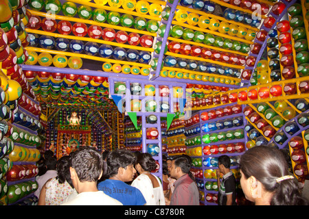 Devotees at 'Karbagan Durga Puja pandal' made of coloured plastic balls in 'Ultadanga', Kolkata (Calcutta), West Bengal, India. Stock Photo