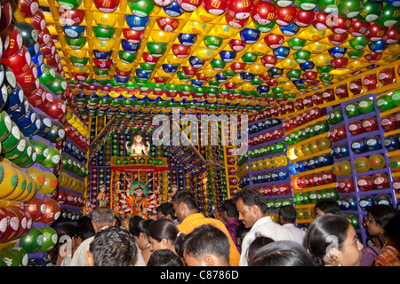 Devotees at 'Karbagan Durga Puja pandal' made of coloured plastic balls in 'Ultadanga', Kolkata (Calcutta), West Bengal, India. Stock Photo