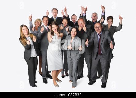 Large group of business people showing thumbs up against white background Stock Photo