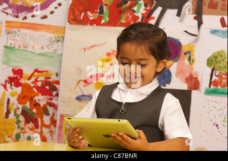 A young girl with ipad 2 Stock Photo