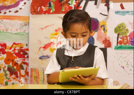 A young girl with ipad 2 Stock Photo