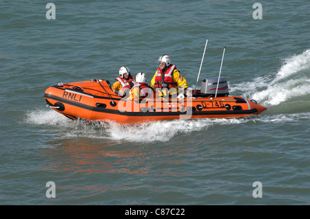 Lifeboat crew in action. Cowes Isle of Wight RNLI Avon type Inflatable D-Class lifeboat in the Solent, England. September 2011. Stock Photo