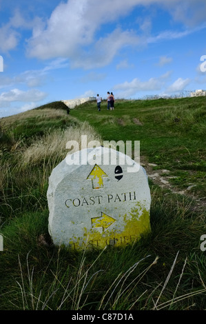 Coastal path stone marker on the isle of Portland Dorset UK showing walks around cliffs Stock Photo