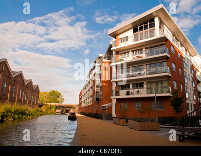 Wolverton Park flats canalside property development beside the historic Grand Union Canal in Milton Keynes and opposite Victorian railway sheds. Stock Photo