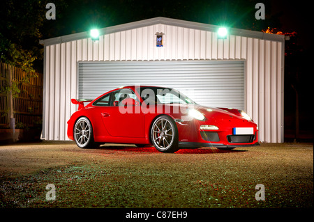 Porsche GT3 in red lit at night Stock Photo