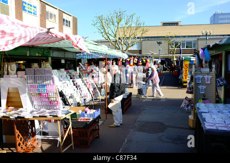 People shopping in Basildon Market in Essex. Stock Photo