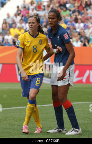 Lotta Schelin of Sweden (L) and Wendie Renard of France (R) wait for a corner kick during the 2011 Women's World Cup third place Stock Photo