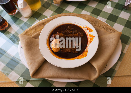 Elk200-2687 Ethiopia, Axum, Ethiopian food, doro wat and injera. Stock Photo