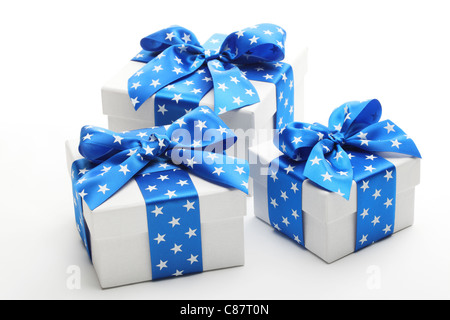White gift boxes with blue ribbon. Stock Photo