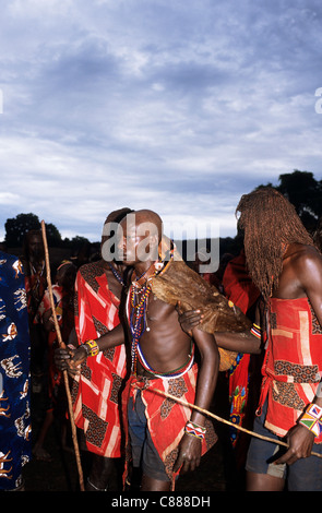 Lolgorian, Kenya. Siria Maasai; Eunoto ceremony; newly shaved moran wearing ceremonial cow hide cape. Stock Photo