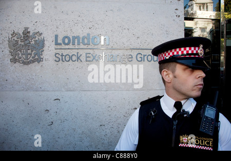 Police protect the London Stock Exchange at Occupy London protest, October 15th 2011. Protest spreads from the US with this demonstrations in London and other cities worldwide. The 'Occupy' movement is spreading via social media. Stock Photo