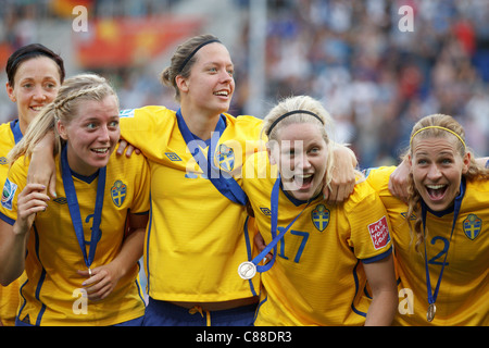 Sweden players Therese Sjogran, Linda Sembrant, Lina Nilsson and Charlotte Rohlin (L-R) celebrate winning World Cup 3rd Place. Stock Photo